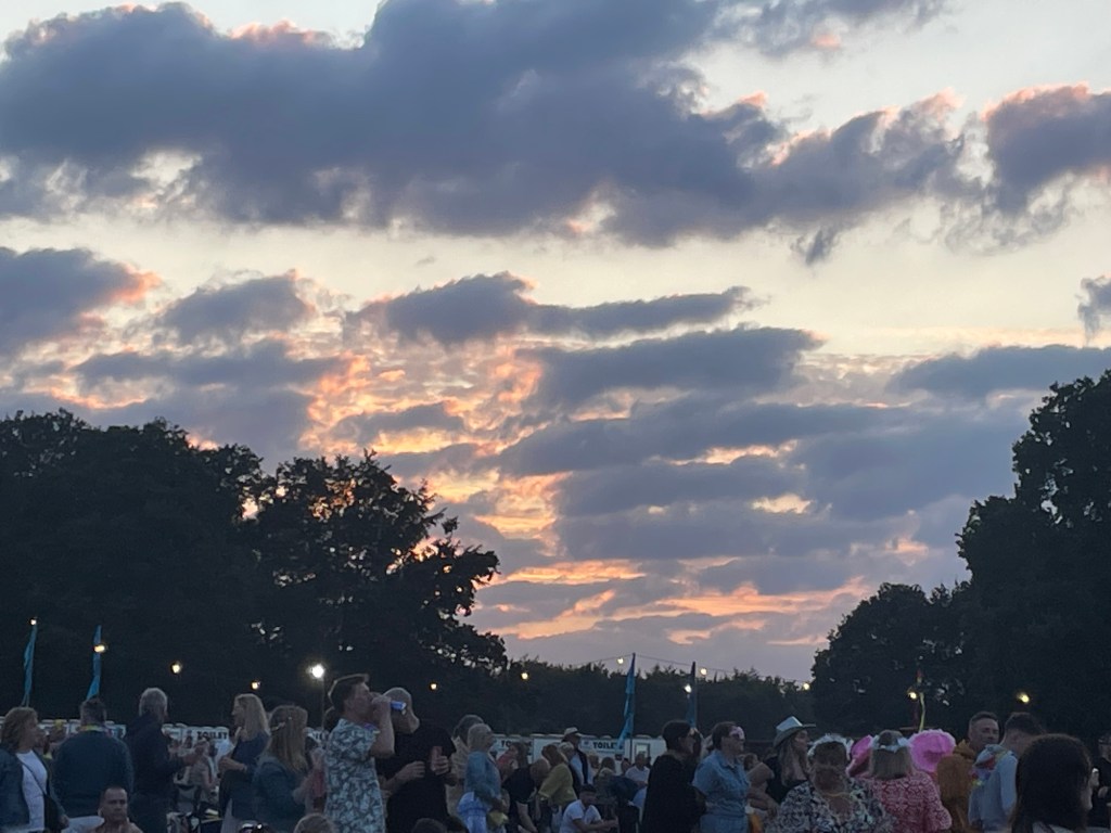Orange sunset sky with grey clouds